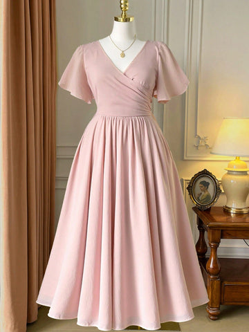 Step into the spotlight with this playful plus-size chiffon dress, designed to flatter every curve. Featuring a chic V-neck and breezy short sleeves, its bodycon fit blends elegance with comfort. The flowing A-line maxi silhouette makes it perfect for spring and summer soirées, ensuring you dance the night away in style and ease.