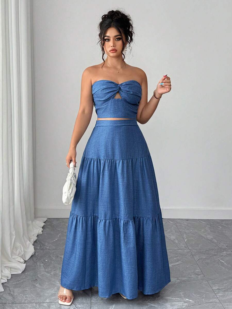 Escape to paradise in this stunning two-piece set that's equal parts chic and comfortable! The twist bandeau top features a flattering silhouette that celebrates your curves, while the flowing pleated maxi skirt moves beautifully with every step. Crafted in a gorgeous blue hue perfect for sun-soaked getaways, this set transitions effortlessly from beachside brunch to sunset strolls. Whether you're lounging poolside or exploring tropical destinations, you'll feel confident, elegant, and absolutely fabulous. 