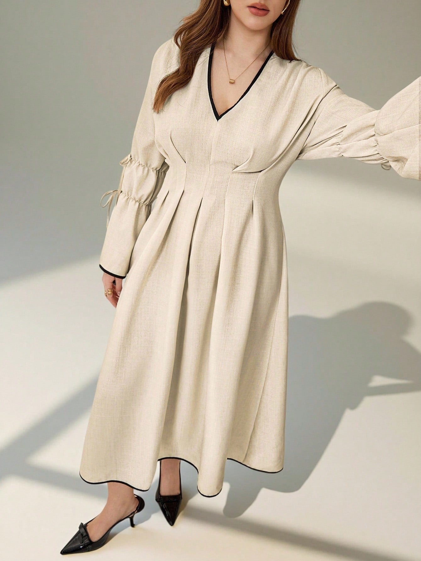 Slip into sophistication with this stunning plus-size A-line dress that's ready for your moment to shine. The flattering gathered pleats add dimension and movement, while the chic contrast trim frames your silhouette beautifully. Whether you're heading to a romantic dinner, walking down the aisle as a guest, or celebrating life's special moments, this dress delivers elegance with effortless grace. The timeless A-line cut is designed to flatter every curve, making you feel confident and gorgeous from the fir