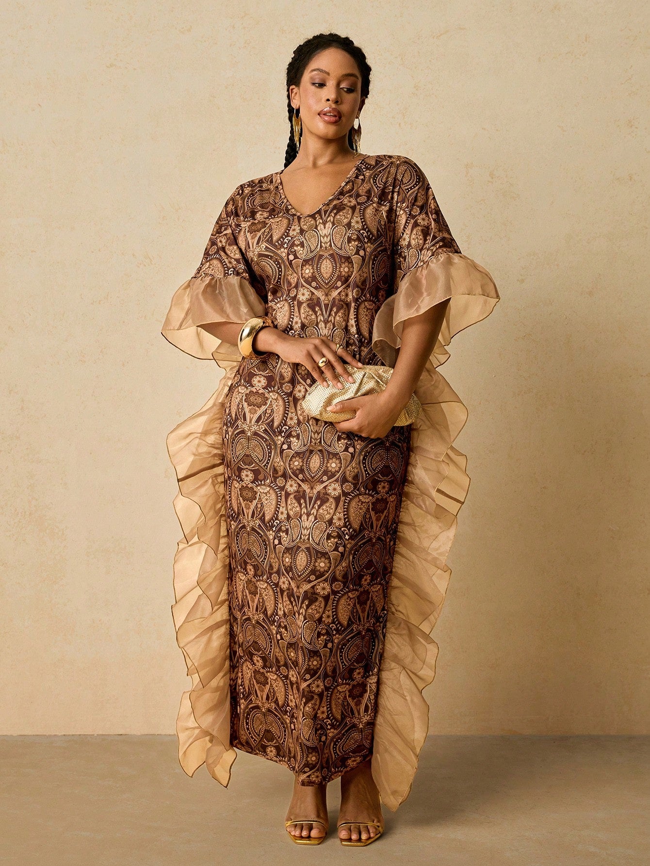 Celebrate in style with this stunning African print kaftan dress, designed for curves and confidence. The flattering V-neckline and cascading ruffles create movement and dimension, while the vibrant print brings festive energy to any holiday gathering. Perfect for Christmas parties, New Year's Eve, or any special occasion, this plus-size beauty combines comfort with elegance. Slip it on and let the rich colors and bold patterns do the talking—because looking fabulous should feel effortless.