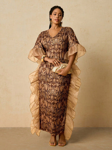 Celebrate in style with this stunning African print kaftan dress, designed for curves and confidence. The flattering V-neckline and cascading ruffles create movement and dimension, while the vibrant print brings festive energy to any holiday gathering. Perfect for Christmas parties, New Year's Eve, or any special occasion, this plus-size beauty combines comfort with elegance. Slip it on and let the rich colors and bold patterns do the talking—because looking fabulous should feel effortless.