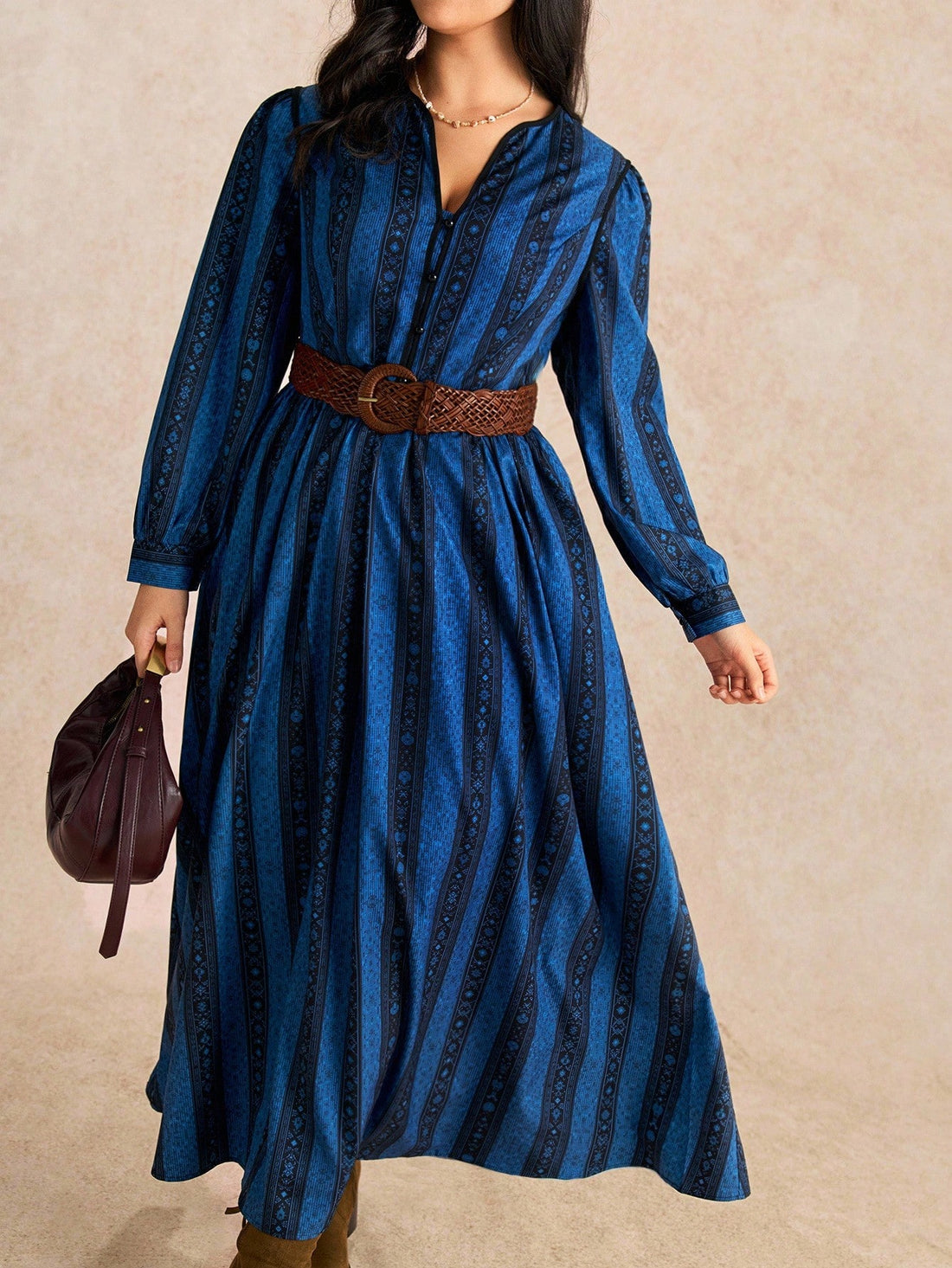 Make a statement in this stunning plus-size maxi dress that effortlessly blends sophistication with fun. The asymmetrical cut and mixed striped-floral pattern create visual intrigue, while the flowing silhouette flatters and moves beautifully. Perfect for date nights, celebrations, or any occasion where you want to feel confident and fabulous. Dress it up with heels and jewelry, or keep it casual—this versatile piece adapts to your vibe and makes sure all eyes are on you.