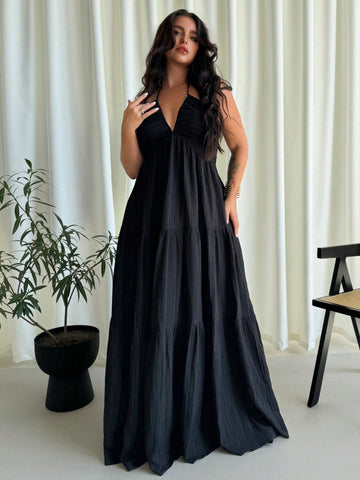 Turn heads effortlessly in this elegant plus size black chiffon halter dress, designed to flatter every curve. Its airy chiffon fabric keeps you cool on beach dates, while the backless design adds a touch of daring sophistication perfect for weddings or vacation evenings. Play up your confidence and dance the night away with a look that's as fun as your plans.