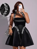 Black satin-look halter mini dress with pearl and rhinestone neckline
