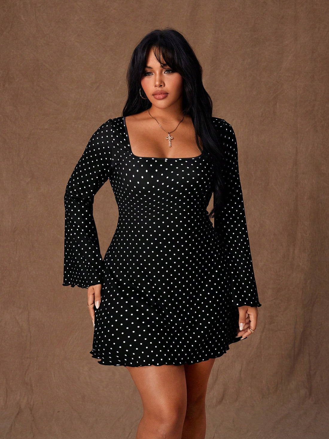 Turn heads at your next autumn soirée in this stunning black polka dot bodycon mini dress. The flare sleeves add a romantic flair while the daring backless design keeps things sultry and sophisticated. Perfectly tailored for plus-size figures, this dress hugs your curves in all the right ways, making you feel confident and fabulous. Whether you're dancing the night away or enjoying intimate gatherings, this playful yet elegant piece is your go-to for making a memorable entrance.
