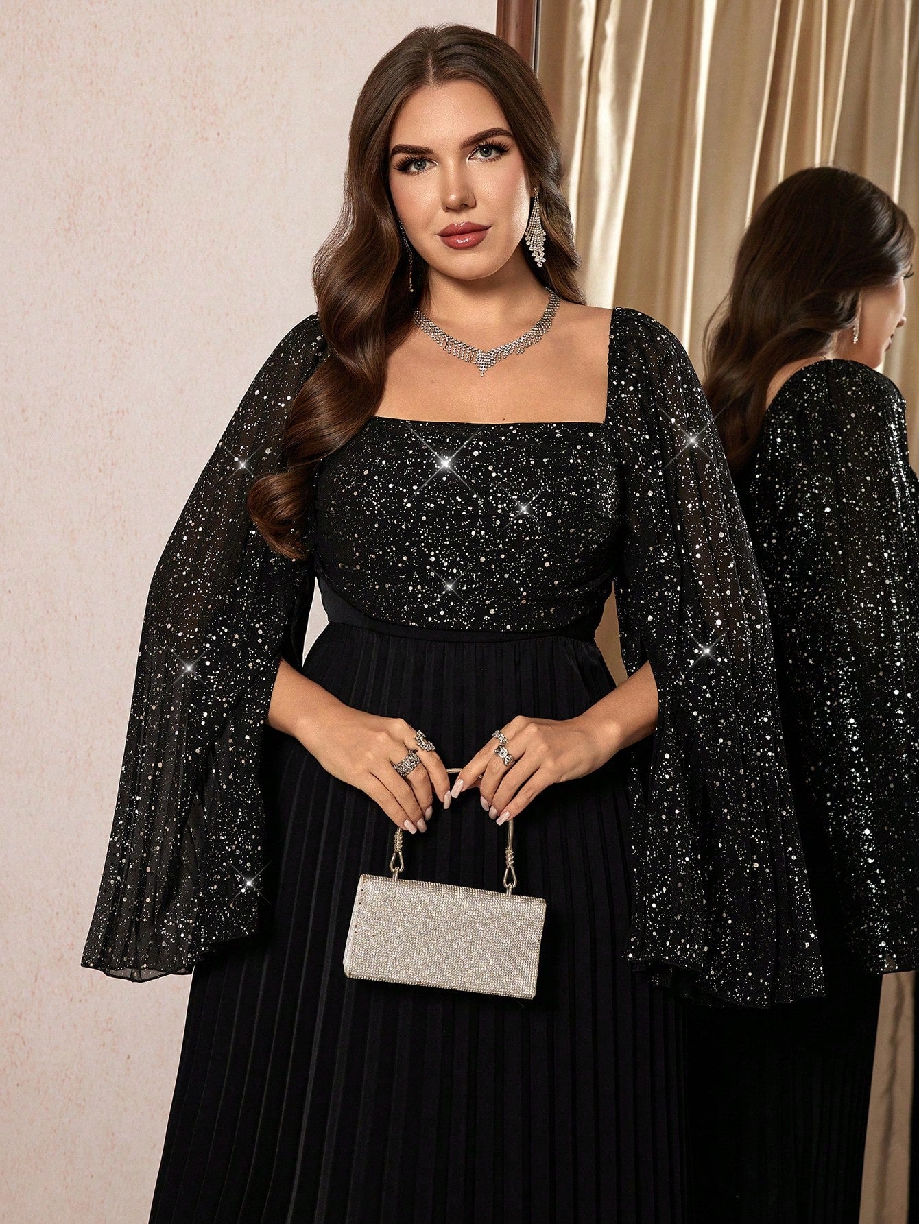 Make a statement in this stunning black chiffon party dress that's as fabulous as you are! The shimmering fabric catches the light beautifully, while the romantic square neckline frames your shoulders with elegance. A fitted waist creates a flattering silhouette that celebrates your curves. Whether you're heading to a wedding, cocktail party, or special night out, this versatile dress transitions seamlessly from season to season. Designed for the modern woman who refuses to compromise on style or comfort, i