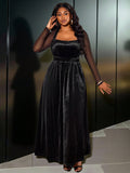 Step into the spotlight in this stunning black velvet A-line dress designed for those who love to make an entrance. The luxurious velvet fabric drapes beautifully while the flattering A-line silhouette celebrates your curves with confidence. A daring slit and sheer details add just the right amount of allure and sophistication. Perfect for parties, galas, or any occasion where you want to feel absolutely fabulous. Available in plus sizes because elegance has no limits.