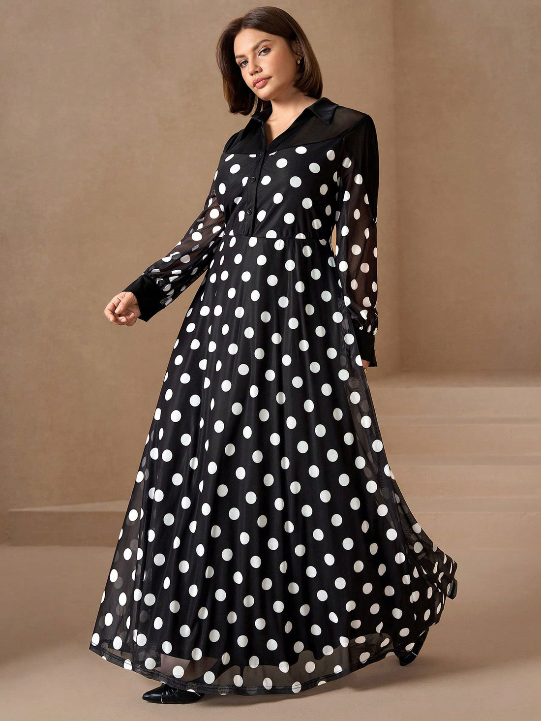 Make a statement in this charming plus-size dress that effortlessly transitions from brunch to evening plans! The timeless black and white polka dot pattern brings a touch of retro flair, while the long sleeves offer elegant coverage and versatility. Flattering cut designed to celebrate your curves with confidence. Perfect for date nights, office events, or whenever you want to feel fabulous and put-together. A wardrobe essential that proves polka dots never go out of style!