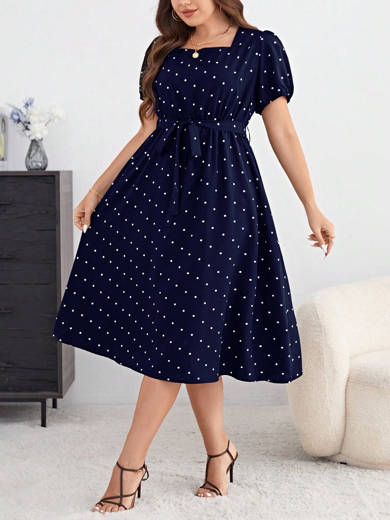 Step into summer with this playful plus size blue polka dot dress, featuring charming puff sleeves and a flattering belt to highlight your waist. Its light, breezy fabric keeps you cool and comfortable, while the classic polka dot pattern adds a fun, timeless touch to your wardrobe. Perfect for sunny days and casual outings, this dress effortlessly blends elegance with a spirited vibe.