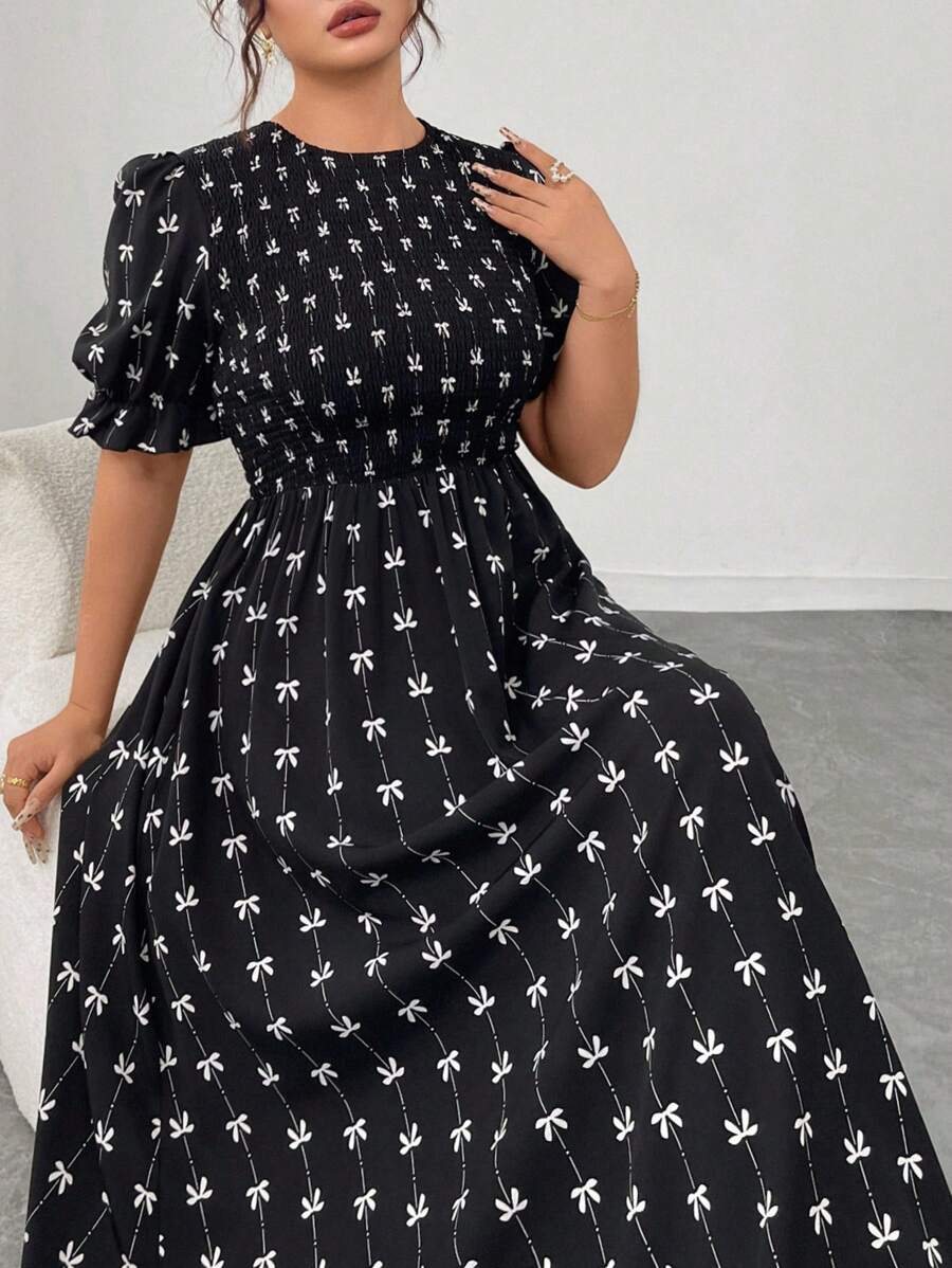 Slip into sophistication with this stunning plus-size bodycon dress that celebrates your curves in all the right ways. The charming bowknot print adds a whimsical touch, while voluminous puff sleeves bring modern flair and movement. Designed for comfort and confidence, this dress transitions seamlessly from brunch dates to evening celebrations. The fitted silhouette flatters your figure, and the playful details ensure you'll turn heads wherever you go. Perfect for anyone who refuses to compromise on style o