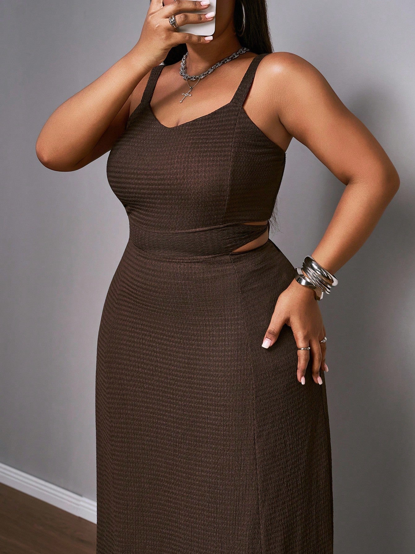 Step into sunshine and style with this elegant plus-size brown cutout tie dress. Perfect for island vacations or lively cocktail parties, its flirty cutouts and adjustable tie detail bring a fun, breezy vibe to your warm-weather wardrobe. Comfortable and effortlessly chic, it’s your go-to dress for making a memorable, playful statement wherever your summer takes you.