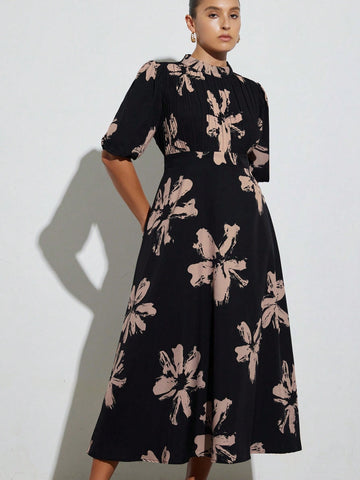 Step out in style with this Elegant Plus Size Brush Print Long Dress. Featuring a high neck and delicate pleated details, it combines comfort with a touch of sophistication. The flowing brush print adds a playful flair, making it perfect for any occasion where you want to feel fabulous and confident.