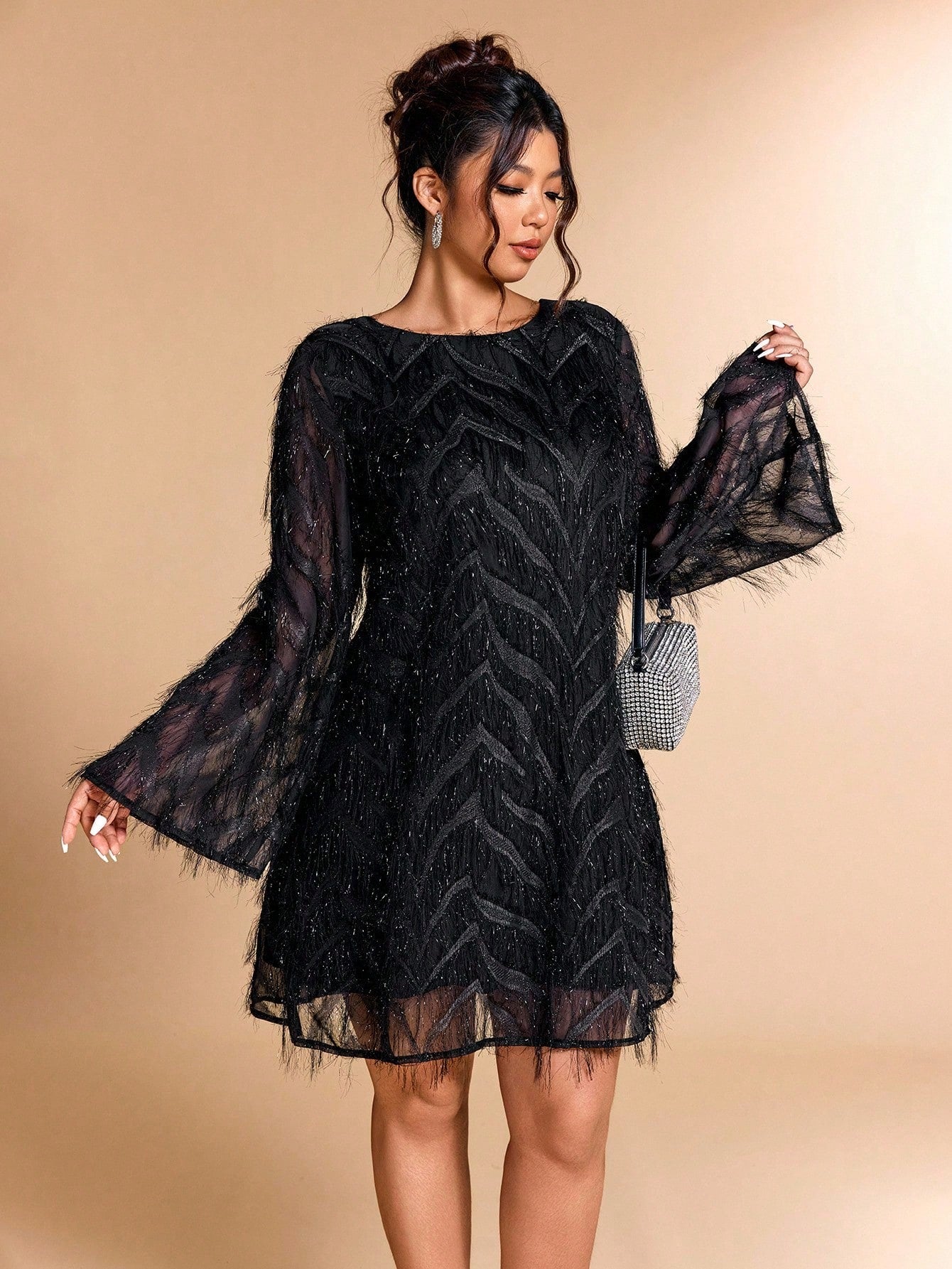 Step out in style and confidence with this Elegant Plus Size Flare Sleeve Dress. Featuring playful flare sleeves and eye-catching fringe details, it brings a fun twist to sophistication. Perfect for turning heads at any event while ensuring a comfortable, flattering fit designed just for you!