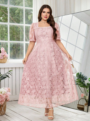 A woman models a light pink lace midi dress with puff sleeves, a square neckline, and a flared skirt in a bright room with a large mirror and window.