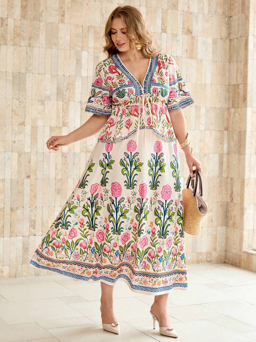 Shop elegant plus size floral Two-Piece Outfits with a V-neck blouse and loose skirt. A feminine, versatile set for summer, vacations, brunch, and parties.
