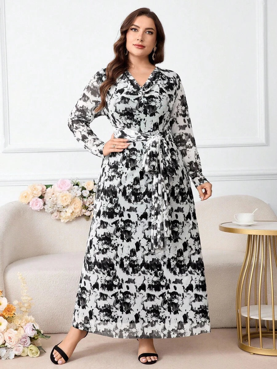 Elevate your wardrobe with this sophisticated plus-size floral dress, designed to flatter and inspire confidence. The graceful draped neckline creates an elegant silhouette while the adjustable tie waist allows you to customize your fit and define your curves beautifully. Vibrant floral prints add timeless charm and versatility, making this piece perfect for everything from casual outings to special occasions. Crafted with quality construction, this dress combines comfort with refined style, ensuring you lo