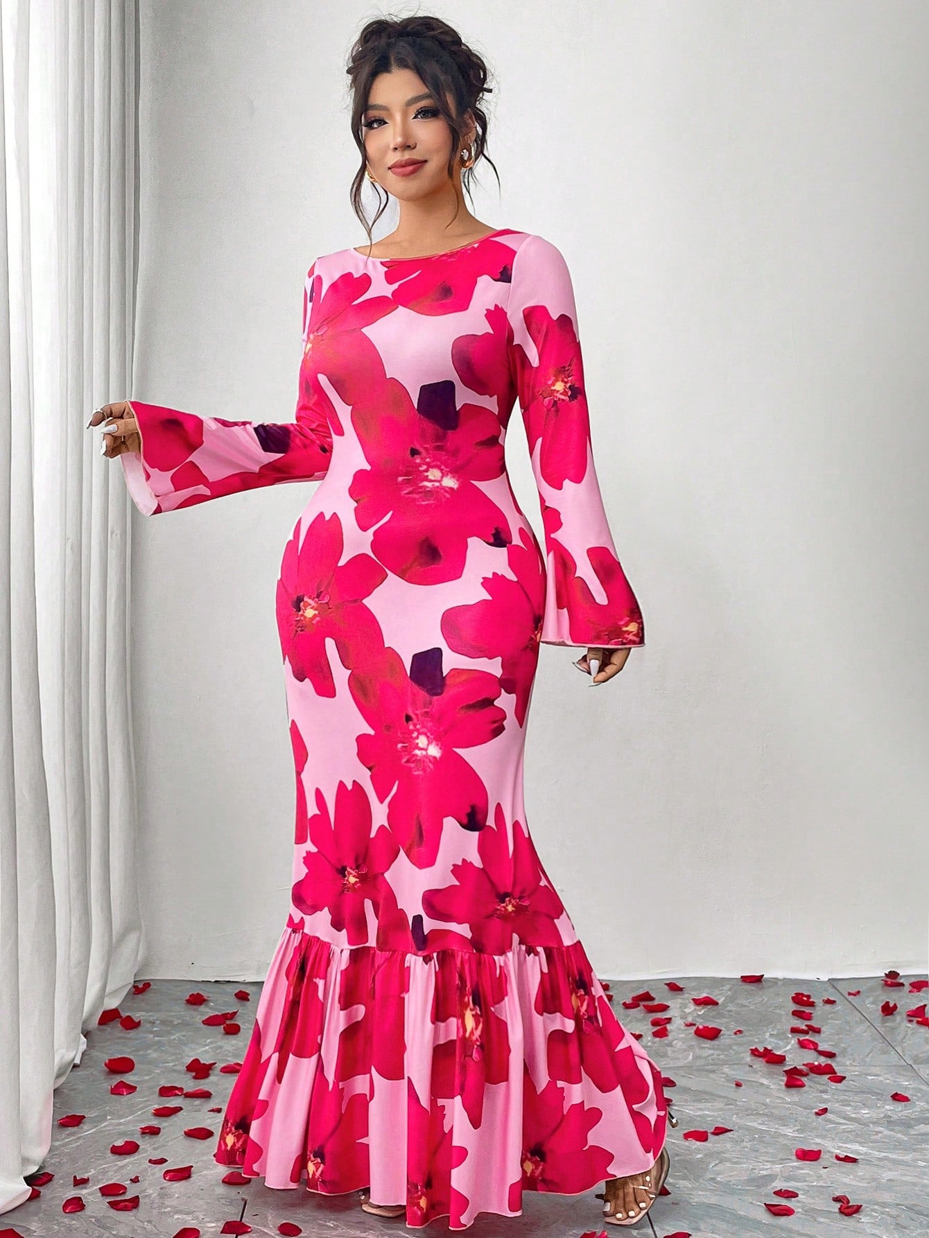 Wrap yourself in effortless elegance with this stunning plus-size floral dress! Featuring a flattering wrap silhouette that celebrates your curves and long, flowy flare sleeves that add a touch of drama and movement, this piece is perfect for everything from brunch dates to evening events. The vibrant floral print brings joy and personality to your wardrobe, while the thoughtful design ensures you'll feel confident and comfortable all day long. A versatile essential that proves style has no size limit!