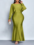 Make a statement in this stunning grass green fishtail gown that celebrates your curves with confidence. The daring backless deep V neckline creates an unforgettable silhouette, while the flowing maxi length adds drama and elegance to every step. Whether you're heading to a gala, wedding reception, or night out with friends, this plus-size beauty delivers show-stopping style that turns heads. The rich grass green hue flatters all skin tones and pairs perfectly with statement jewelry and heels. Slip into sop