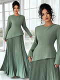 Elevate your seasonal wardrobe with this stunning plus-size green midi dress that's equal parts sophisticated and fun. The asymmetrical hem adds an unexpected twist, while strategic ruching flatters your silhouette beautifully. Perfect for autumn and winter commutes, this versatile piece transitions seamlessly from office to evening plans. The rich green hue complements all skin tones, and the midi length offers that sweet spot between polished and comfortable. Whether you're heading to work or out for the 
