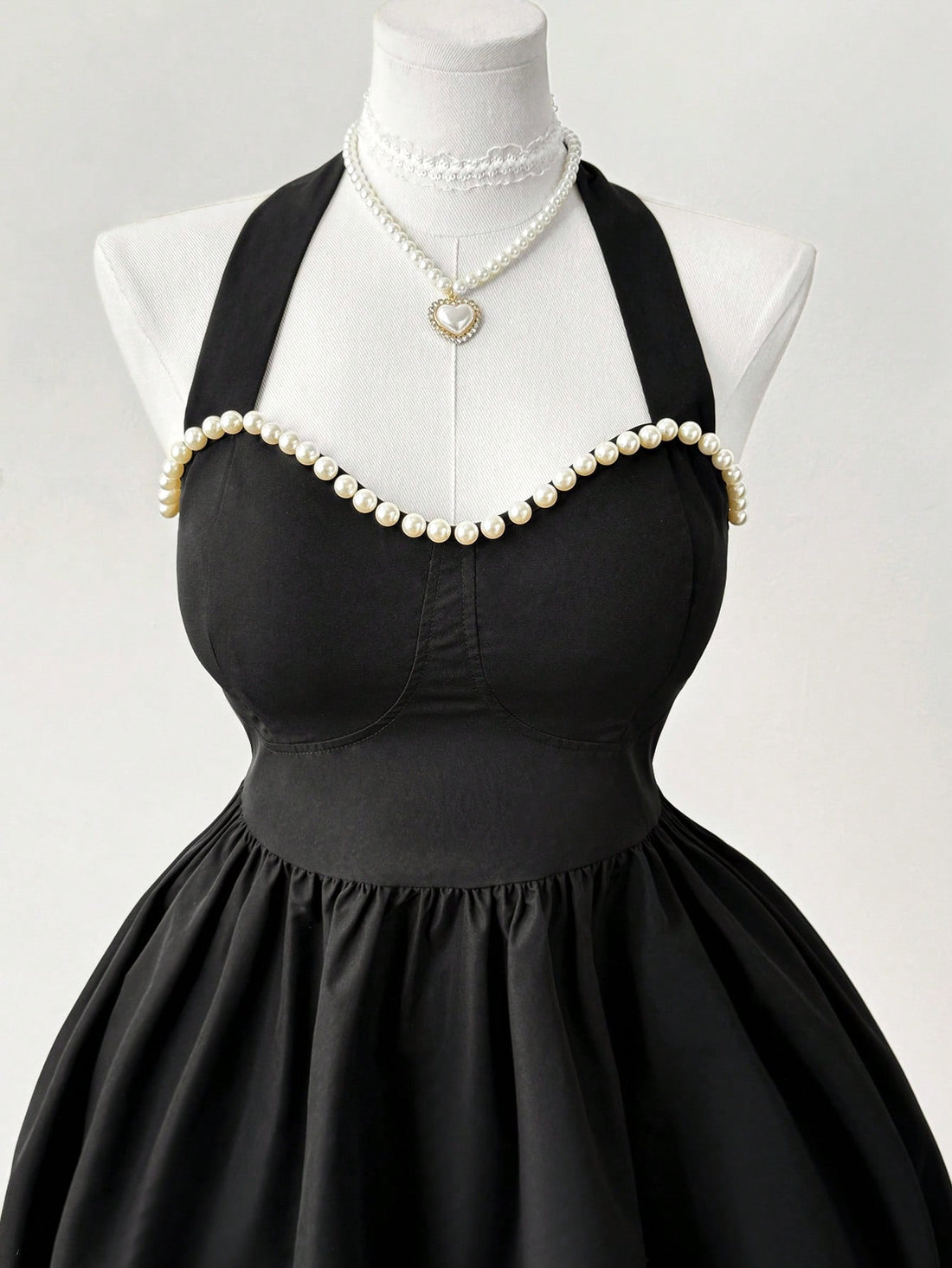 Get ready to turn heads in our Elegant Plus Size Halter A-Line Pearl Dress! With a vintage knee-length style perfect for spring and summer, you'll feel confident and stylish in this unique dress. The halter design adds a touch of elegance, while the pearls provide a touch of glamour. Perfect for any occasion, this dress will be a staple in your wardrobe.