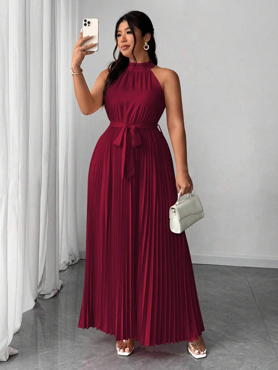 Turn heads on your next getaway with this Elegant Plus Size Halter Neck Vacation Dress. The romantic tie waist flatters your curves while the pleated skirt adds a flirty, flowing touch. Perfect for weddings or sunny celebrations, this dress blends comfort and style effortlessly—making every moment feel like a special occasion. Embrace your vacation vibes and step out with confidence and flair!