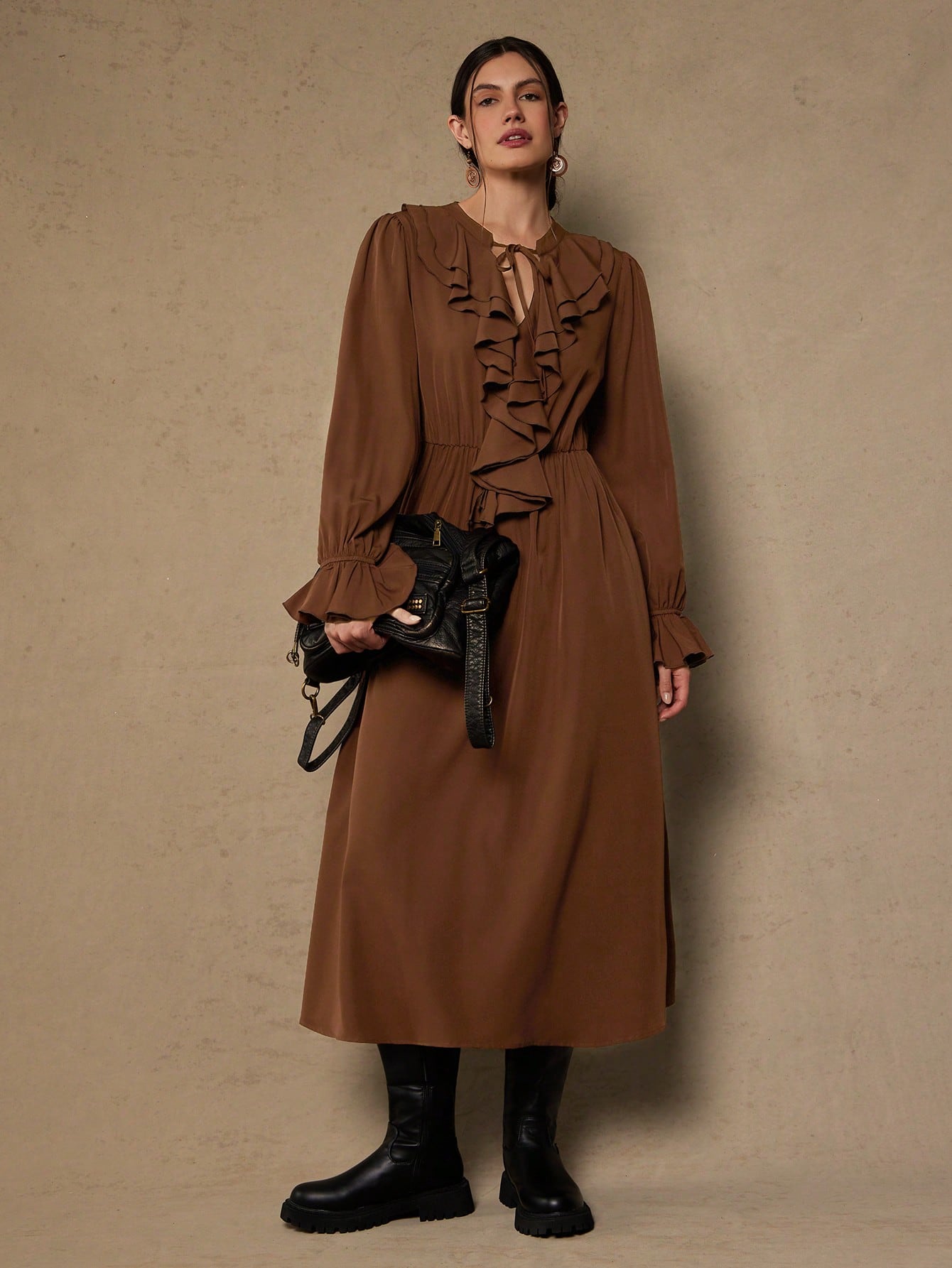 Elevate your wardrobe with this stunning plus-size dress that's equal parts sophisticated and fun! The long sleeves provide elegant coverage while the charming ruffle tie neck adds a flirty touch that draws the eye upward. Crafted in a timeless solid color, this versatile piece transitions seamlessly from office to evening events. The thoughtfully designed silhouette flatters curves beautifully, giving you confidence with every wear. Perfect for anyone who refuses to compromise on style or comfort—because l