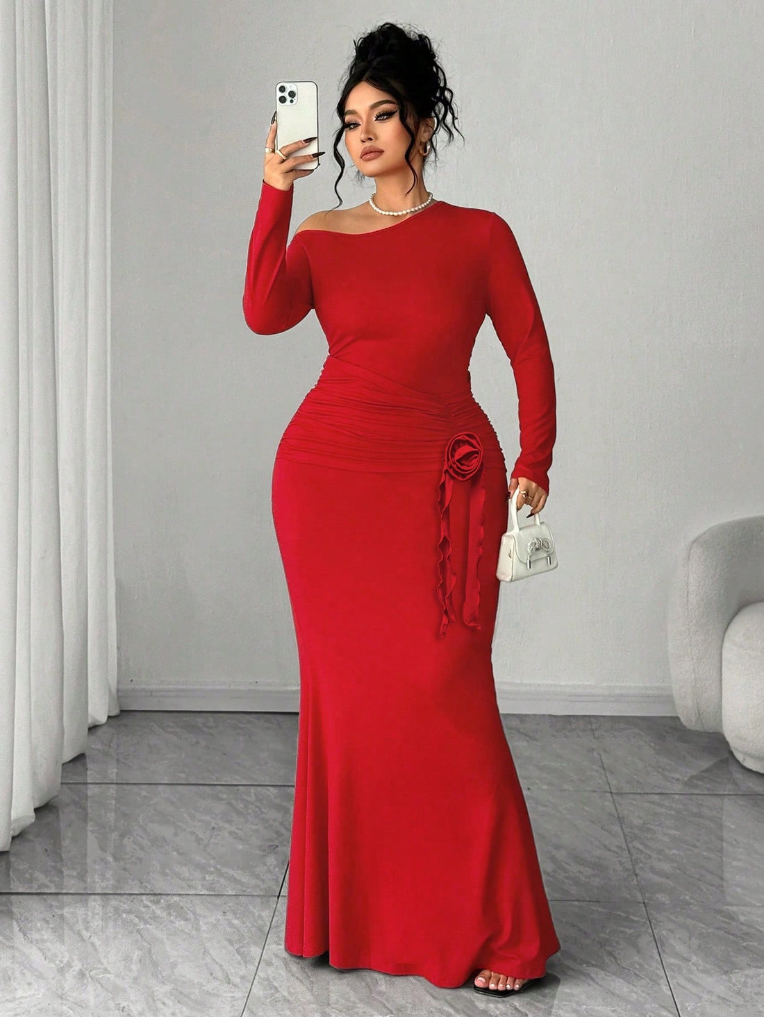 Elevate your wardrobe with this stunning plus-size dress that effortlessly blends sophistication with modern flair. The long sleeves provide elegant coverage while the eye-catching oblique shoulder design adds an unexpected twist that turns heads. Delicate floral accents scattered throughout bring a touch of nature-inspired charm to the solid color base. Perfect for date nights, special occasions, or whenever you want to feel absolutely fabulous in your own skin. This dress celebrates curves with style and 