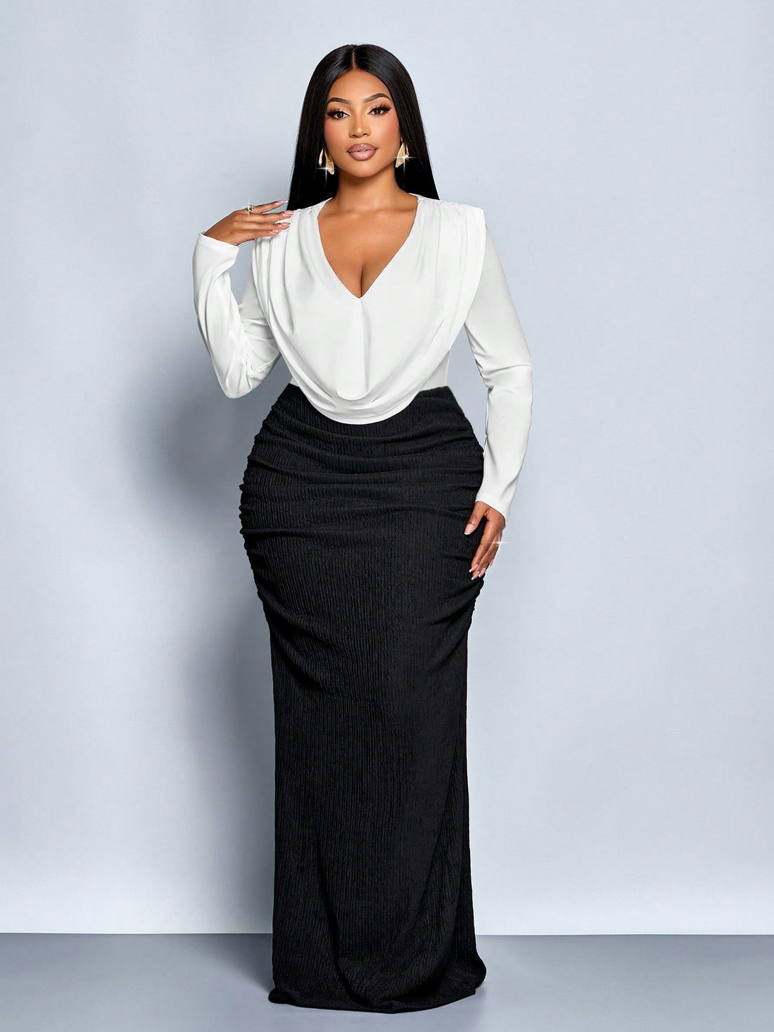 Make a statement this season in our stunning plus-size party dress! Featuring a chic V-neckline and long sleeves perfect for cooler months, this showstopper combines elegance with edge. The eye-catching black and white color-block design flows into a dramatic fishtail hem that'll have you turning heads at every gathering. Flattering, fabulous, and ready for your next celebration—because you deserve to feel absolutely amazing!