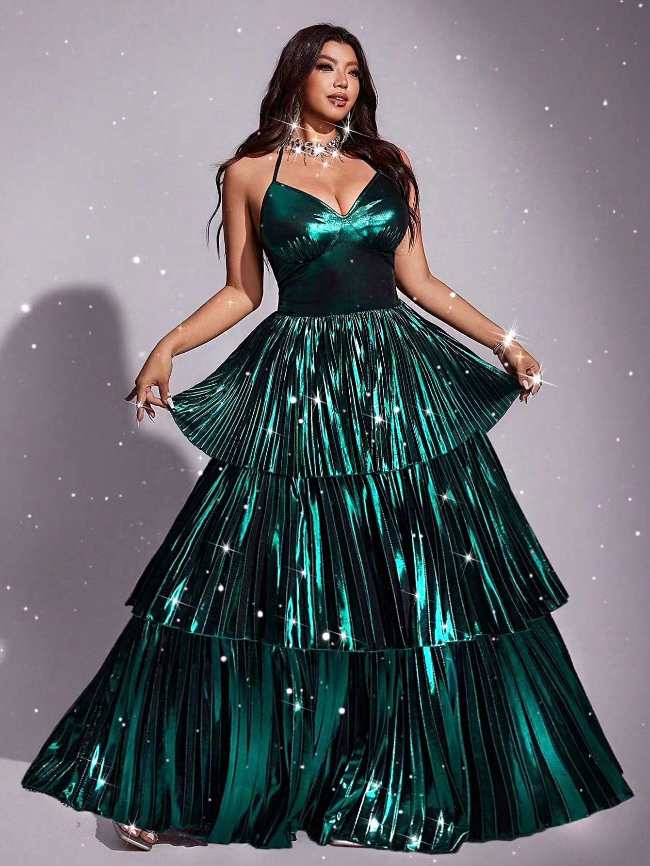 Shine bright like the star you are in this stunning metallic pleated dress! Designed for curves and celebration, this halter-neck beauty features eye-catching shimmer and elegant pleating that flatters your silhouette from every angle. Perfect for parties, galas, or any moment worth dressing up for, this plus-size showstopper combines comfort with glamour. The halter neckline adds a touch of sophistication while the metallic finish catches the light beautifully. Whether you're dancing the night away or maki