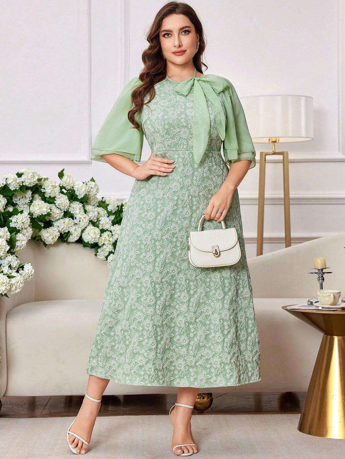 Step out in style with this Elegant Plus Size Midi Dress, featuring a graceful tie collar and a charming floral jacquard pattern. Its flattering midi length and delicate fabric bring a touch of whimsy to your wardrobe, while the tie collar lets you add a flirty twist. Perfect for turning heads at brunch or special occasions, this dress blends comfort and elegance effortlessly.