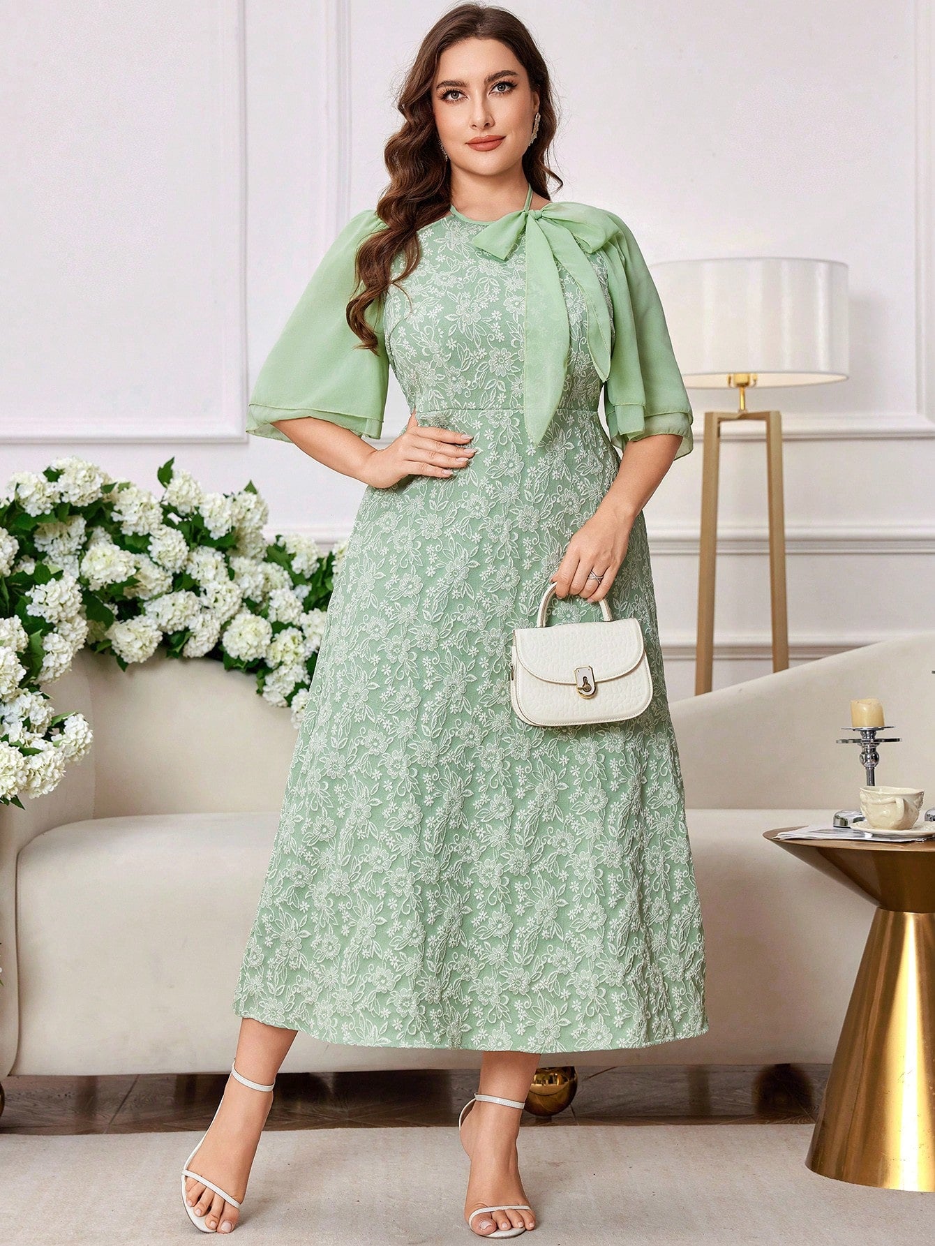 Step out in style with this Elegant Plus Size Midi Dress, featuring a graceful tie collar and a charming floral jacquard pattern. Its flattering midi length and delicate fabric bring a touch of whimsy to your wardrobe, while the tie collar lets you add a flirty twist. Perfect for turning heads at brunch or special occasions, this dress blends comfort and elegance effortlessly.