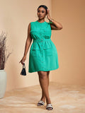 Turn heads with this playful yet elegant plus size mini shirt dress in a rich dark green shade. Its sleeveless design and flattering mandarin collar bring a fresh, stylish edge, while the coordinating belt cinches your waist for a perfect fit. Effortlessly chic, this dress is your go-to for making a confident statement wherever you go.