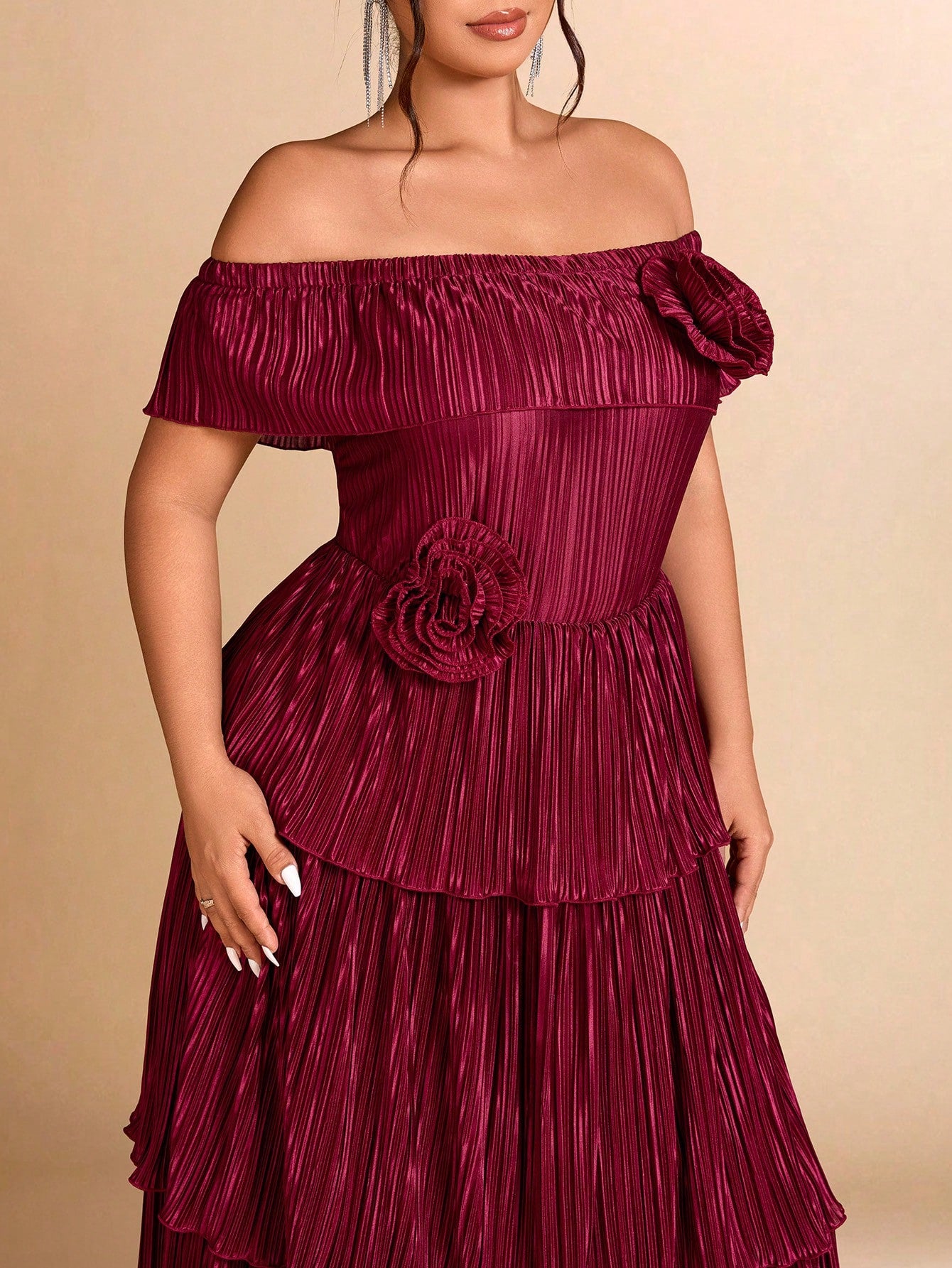 Elevate your wardrobe with this stunning plus-size maxi dress that effortlessly transitions from party nights to everyday elegance. The off-shoulder neckline creates a chic, flattering silhouette while the intricate 3D floral details add dimension and visual interest. Pleated throughout for a graceful drape, this dress celebrates curves with confidence and style. Perfect for making a statement at any occasion, whether you're dancing the night away or enjoying a casual outing. Comfort meets sophistication in