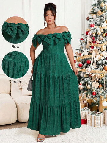 Make a statement this holiday season in this stunning plus-size dress that effortlessly blends sophistication with festive flair. The charming off-shoulder neckline frames your shoulders beautifully, while the playful bow detail adds a touch of whimsy. Unique patchwork elements create visual interest and movement, ensuring you'll turn heads at every Christmas party. Designed for curves and comfort, this dress celebrates your style with confidence and elegance. Perfect for creating unforgettable holiday memo