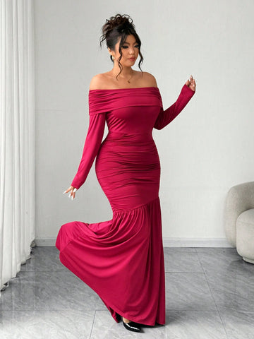 Make a statement at your next celebration in this stunning off-shoulder dress designed for curves and confidence. The cinched waist creates a flattering silhouette while the asymmetric hem adds an unexpected twist of modern flair. Soft, flowing fabric drapes beautifully, letting you move and dance with ease. Perfect for parties, weddings, or any occasion where you want to feel absolutely fabulous. Available in plus sizes because every body deserves to shine.