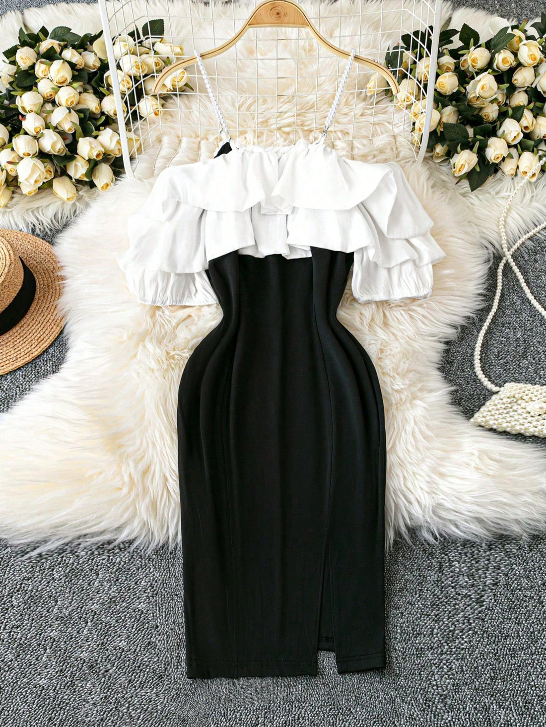 Elevate your fashion game with our Elegant Plus Size Off-Shoulder Pearl Chain Ruffle Bodycon Mini Dress. This stunning dress will make you stand out in any crowd, with its off-shoulder design, exquisite pearl chain detailing, and playful ruffle accents. Perfect for any occasion, this dress will flatter your curves and turn heads wherever you go!