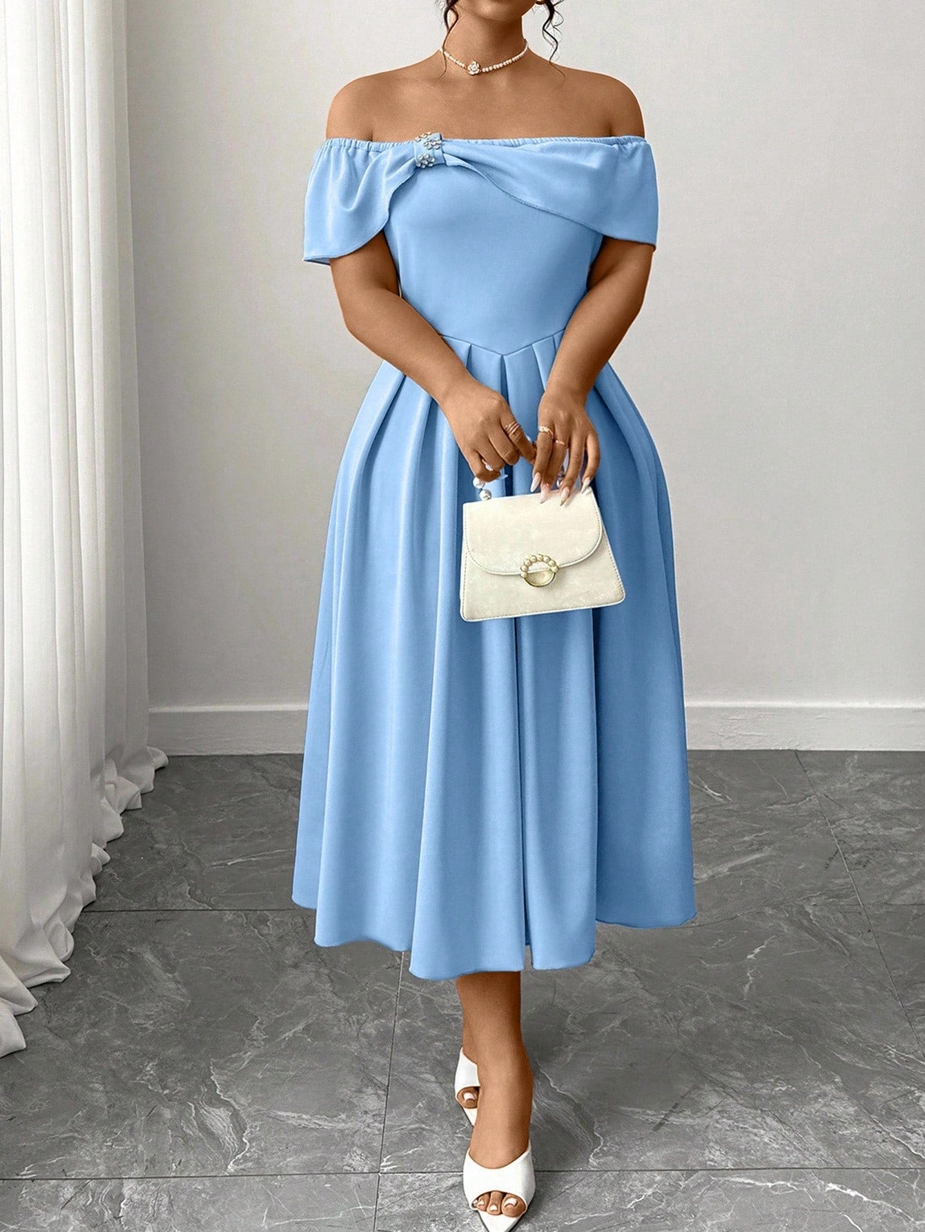 Slip into effortless sophistication with this stunning off-shoulder pleated dress that celebrates curves with style. The graceful draping and timeless solid color create a flattering silhouette perfect for date nights, celebrations, or whenever you want to feel absolutely fabulous. Pleated details add movement and dimension, while the off-shoulder neckline brings that touch of modern elegance. Whether you're heading to brunch or turning heads at an event, this chic piece proves that confidence looks best in