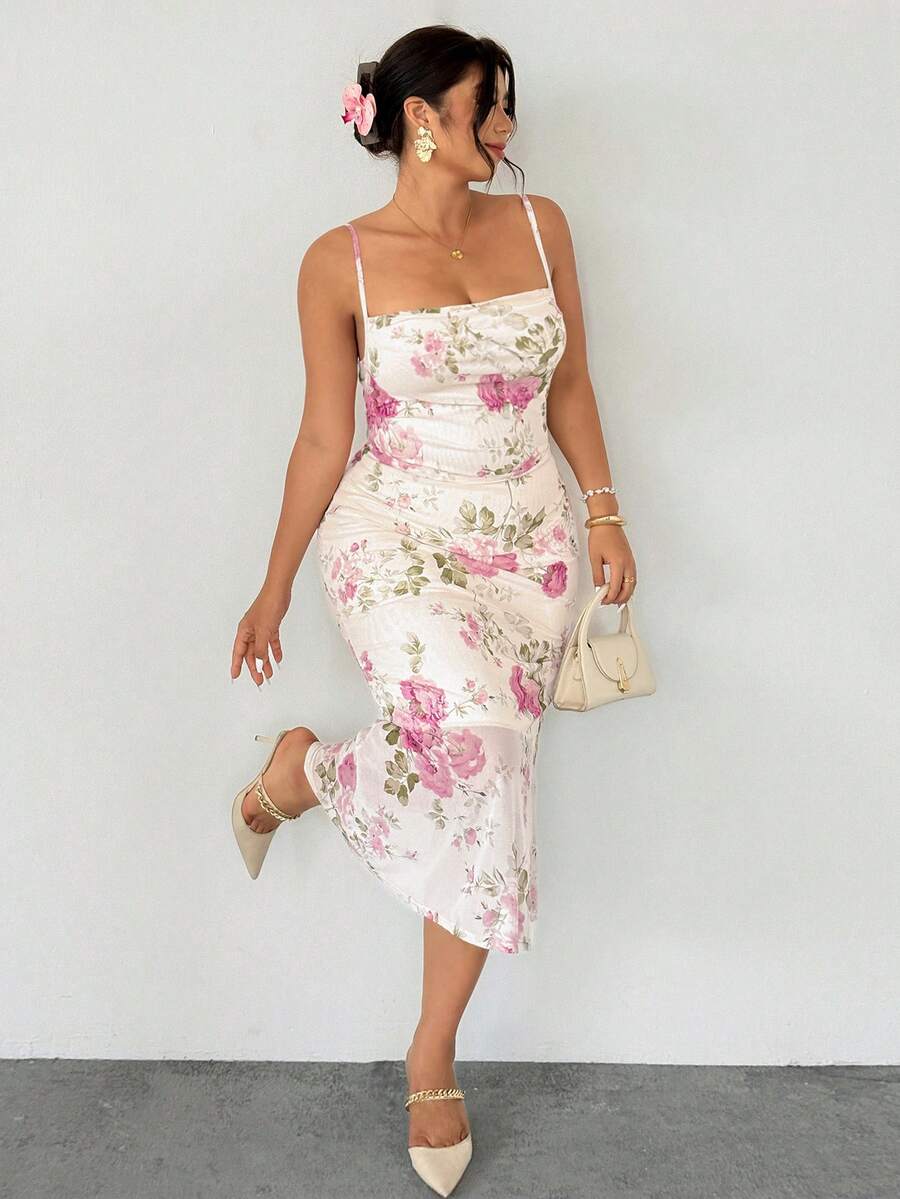 Celebrate summer in style with this stunning plus-size pink floral mermaid midi dress. The romantic floral print brings playful charm, while the flattering mermaid silhouette creates an elegant, feminine shape. Perfect for garden parties, brunches, or any warm-weather occasion where you want to feel confident and beautiful. The midi length offers sophisticated coverage with a touch of whimsy. Designed for curves, this dress combines comfort with timeless elegance.