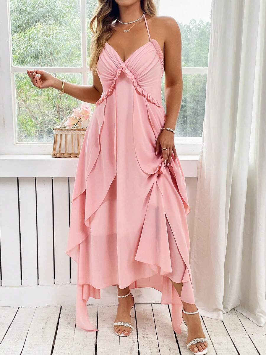 Step into charm with this Elegant Plus Size Pink Maxi Dress, featuring delicate spaghetti straps and a whimsical French ruffle back. Its flowing silhouette flatters your curves while adding a touch of playful sophistication to any occasion. Perfect for twirling through summer days or making a statement at evening events.