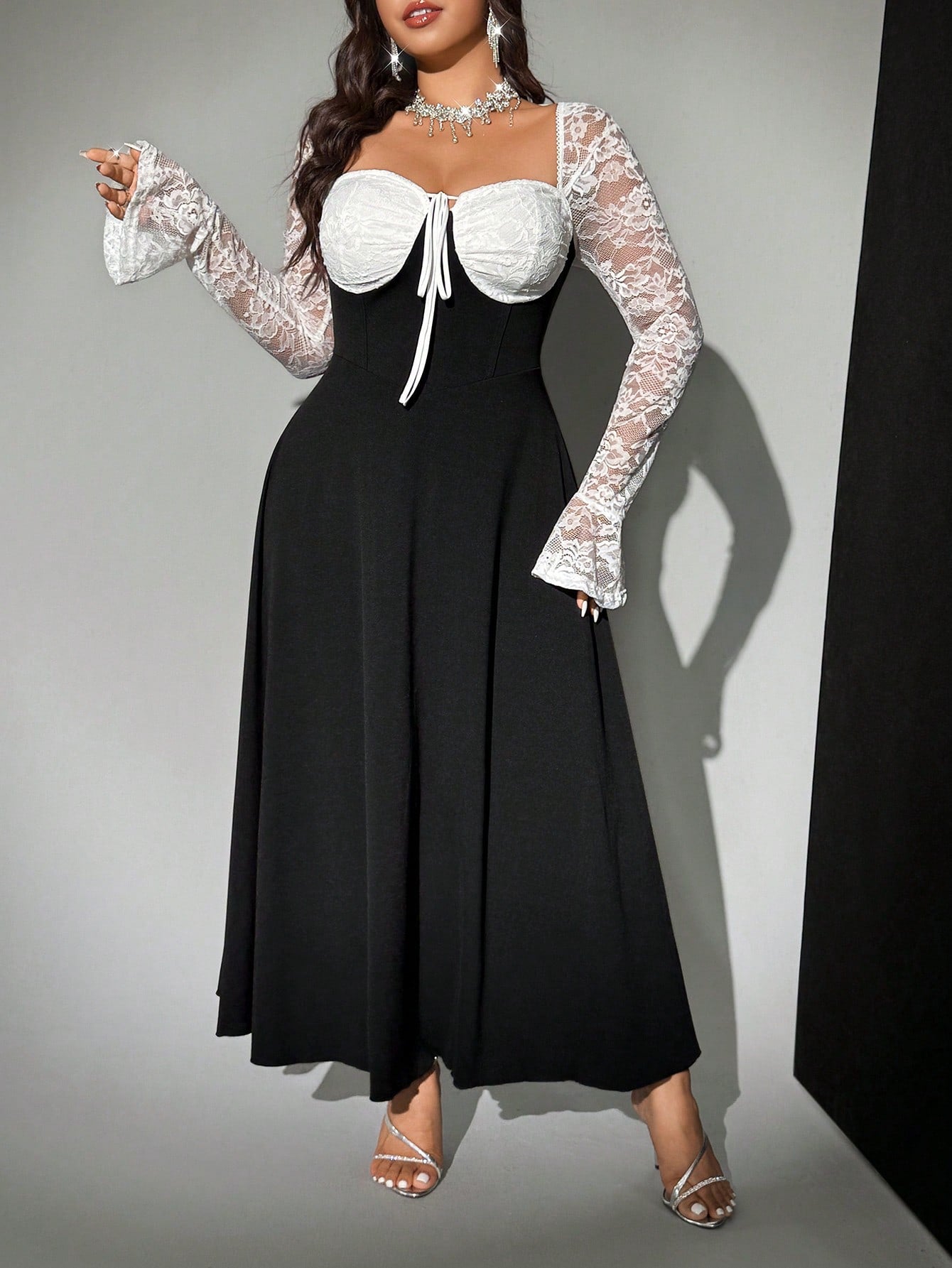 Step into timeless charm with this Elegant Plus Size Retro Dress! Featuring a flattering round neck, delicate pleats, and a playful tie-front, this long-sleeve party dress blends vintage vibes with modern flair. The black and white lace patchwork adds a touch of whimsy, making it perfect for dancing the night away or turning heads at any event. Celebrate your curves in style and let your confidence shine!