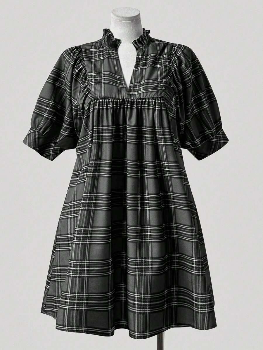 Step into timeless style with this charming plus-size plaid dress that brings vintage flair to your modern wardrobe. The flattering V-neckline pairs beautifully with delicate ruffle trim detailing, creating an effortlessly elegant silhouette. Perfect for anyone who loves retro-inspired fashion with a contemporary twist, this dress transitions seamlessly from casual outings to special occasions. Embrace your curves with confidence in a piece designed to celebrate your unique style and personality.