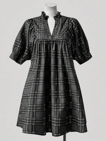 Step into timeless style with this charming plus-size plaid dress that brings vintage flair to your modern wardrobe. The flattering V-neckline pairs beautifully with delicate ruffle trim detailing, creating an effortlessly elegant silhouette. Perfect for anyone who loves retro-inspired fashion with a contemporary twist, this dress transitions seamlessly from casual outings to special occasions. Embrace your curves with confidence in a piece designed to celebrate your unique style and personality.