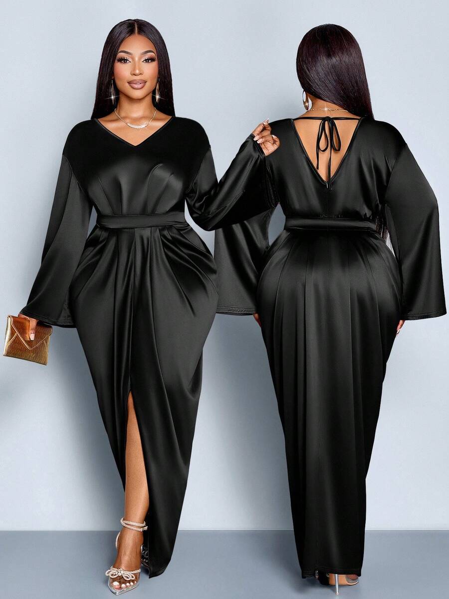 Slip into sophistication with this stunning plus-size satin dress that's ready for anything your calendar throws at you. The luxe V-neckline flatters while the pleated waist creates a beautifully defined silhouette. Flowing to an elegant floor-length hem, this versatile piece transitions seamlessly from boardroom meetings to evening celebrations. The silky satin fabric drapes gorgeously and feels as amazing as it looks. Whether you're commanding a presentation or dancing the night away, this dress delivers 