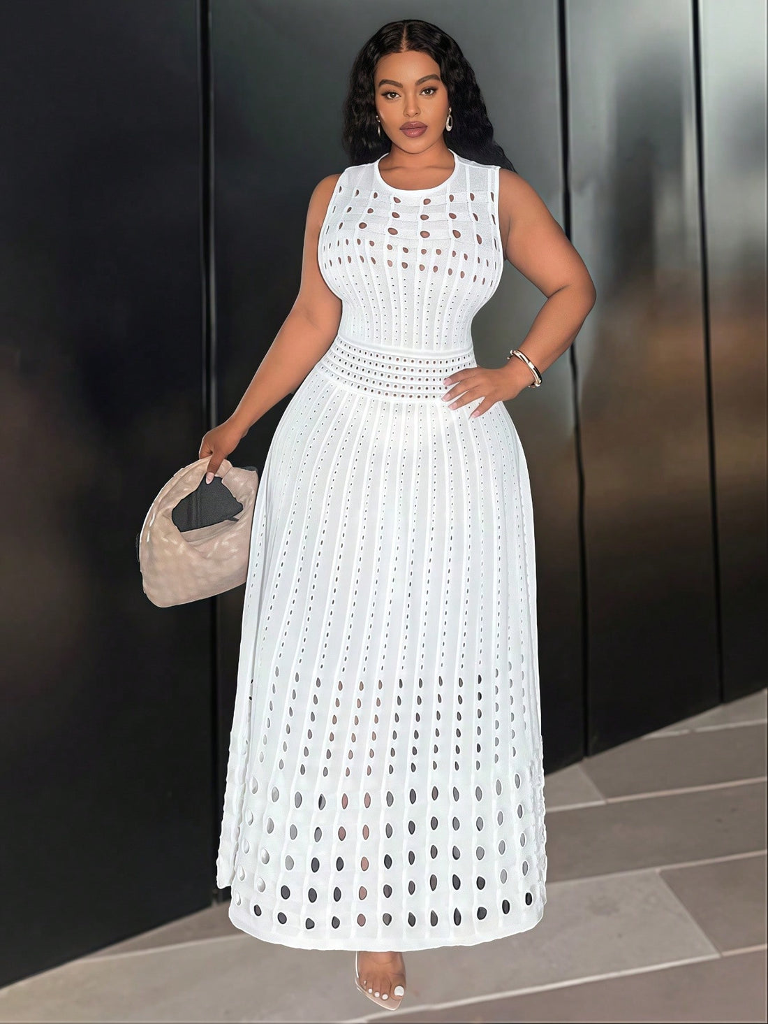 Step into autumn and winter parties with flair in this Elegant Plus Size Sleeveless Knit Dress. The playful hollow design adds a chic twist while keeping you cozy without sleeves. Perfectly cozy yet stylish, it flatters your curves and lets you dance the night away in confidence and comfort. Celebrate every moment wrapped in warmth and charm!