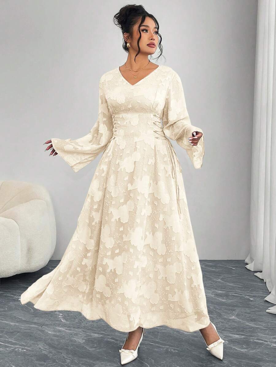 Step into charm and comfort with this Elegant Plus Size Solid Color Dress. Featuring playful cut-outs and flared sleeves, it brings a fun twist to sophistication. The cross tie waist highlights your silhouette while adding a flirty touch. Perfect for making every occasion effortlessly stylish!