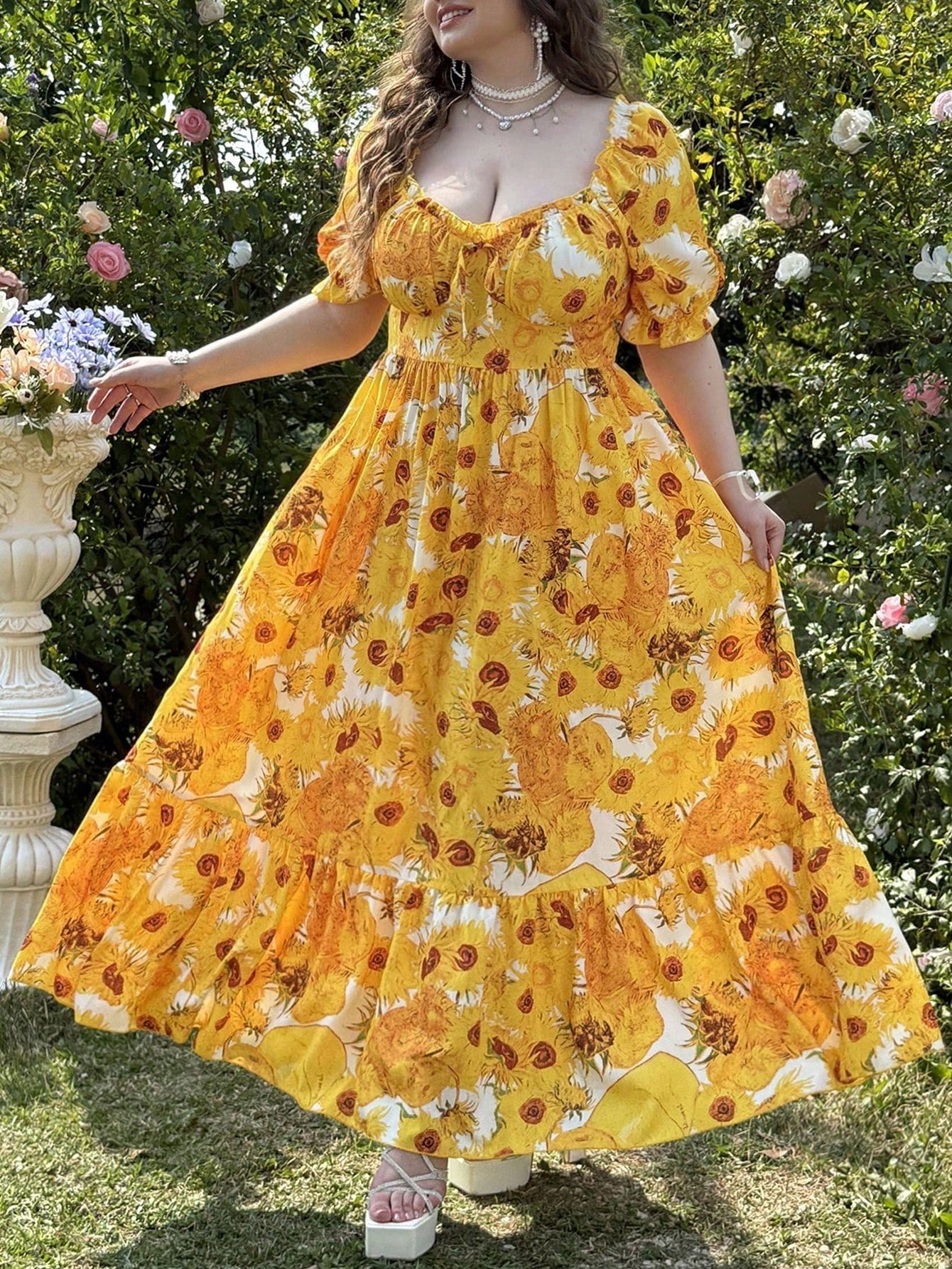 Be the sunshine in our Elegant Plus Size Summer Midi Dress. With beautiful puff sleeves and a playful sunflower print, this dress will make you stand out at any summer event. Perfect for curvy fashionistas who want to make a statement. Get ready to turn heads!
