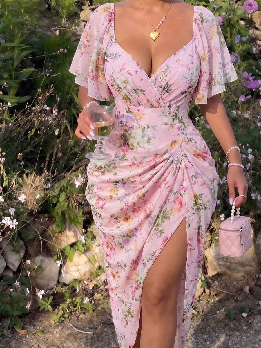 Model in pink floral sweetheart midi dress with flounce sleeves and side slit
