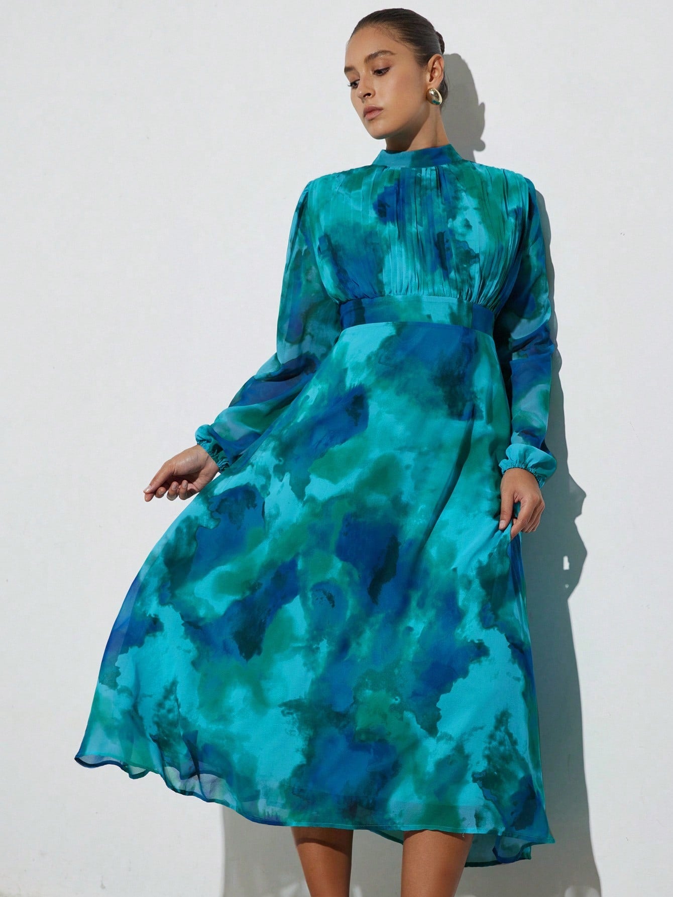 Step out in style with this Elegant Plus Size Tie-Dye Long Sleeve Dress, designed to flatter every curve with its ruched waist. Perfect for commuting or casual outings, its vibrant tie-dye pattern adds a fun twist to your wardrobe while the long sleeves keep you cozy. Effortlessly chic and comfortable, this dress is your new go-to for a playful yet polished look.