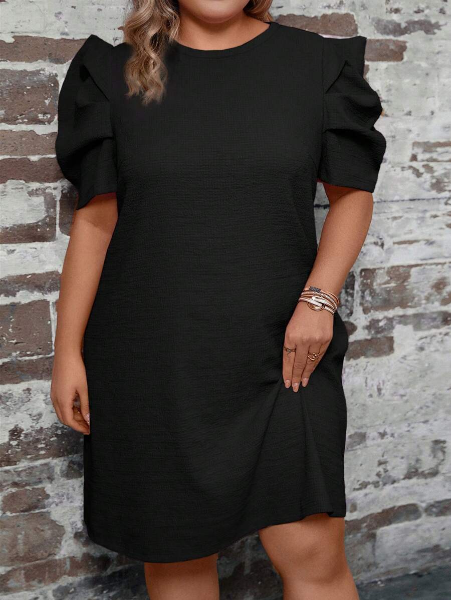 Step out in style with this playful plus size tie dye mini dress featuring charming puff sleeves and a flattering round neck. Its vibrant pattern and comfortable fit make it perfect for sunny days and casual outings, adding a fun splash of color to your wardrobe.