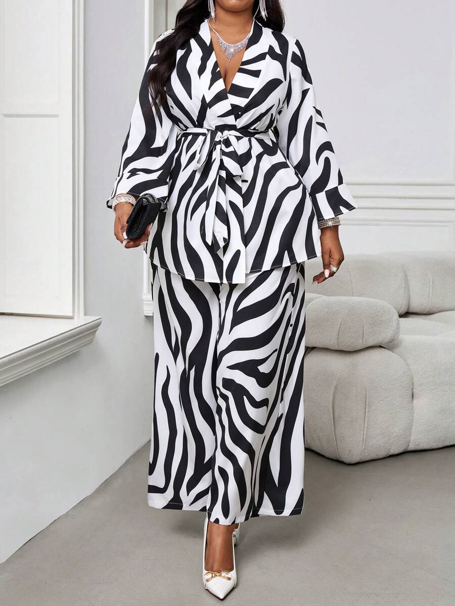 Elevate your seasonal wardrobe with this chic two-piece set designed for the modern, confident woman. The crisp white long-sleeve top pairs perfectly with tailored pants, creating an effortlessly polished look that transitions seamlessly from office to evening plans. Crafted with plus-size proportions in mind, this set celebrates your curves while delivering timeless elegance. Whether you're layering through chilly fall days or making a statement this winter, you'll feel fabulous and put-together. A versati